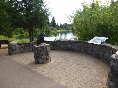 Miniature replica of Willamette meteor with interpretive displays on curved rock wall
